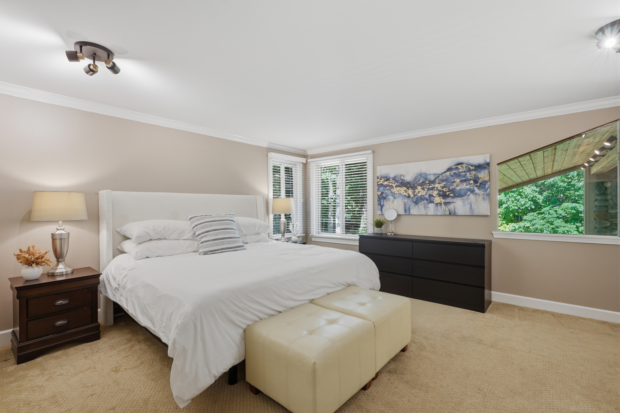 Primary bedroom with wooded views