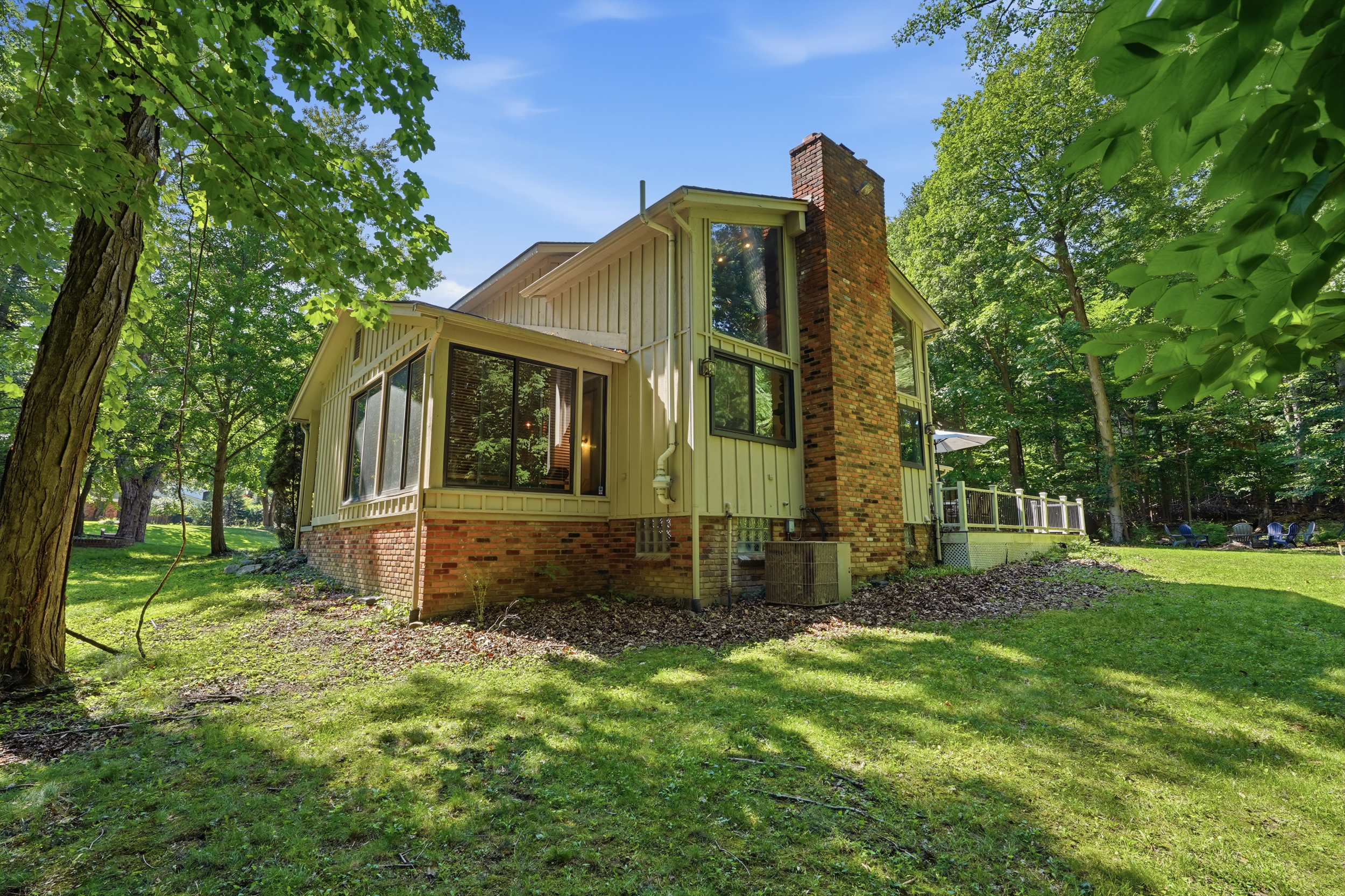 Rear exterior set among mature trees